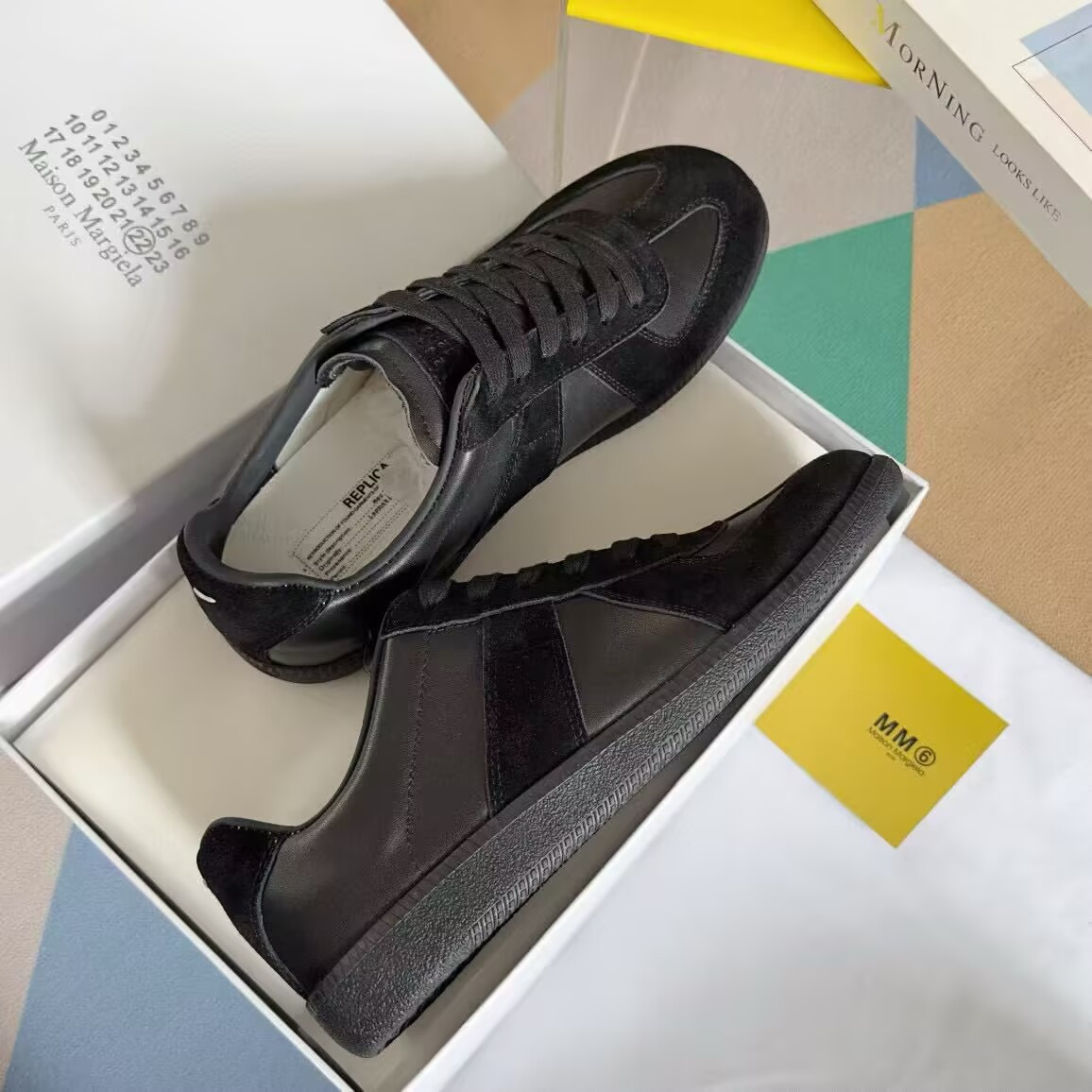 ua ma*s*n Ma*i*la mm6 sneakers