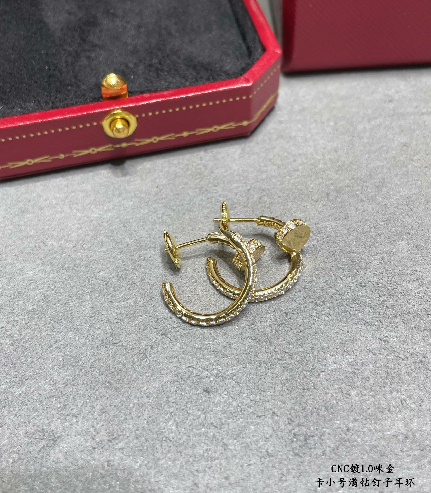 ca*t*er fully Di*m*nd-encrusted small nail earrings